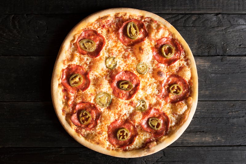 dion's pizza topped with roasted Hatch green chile